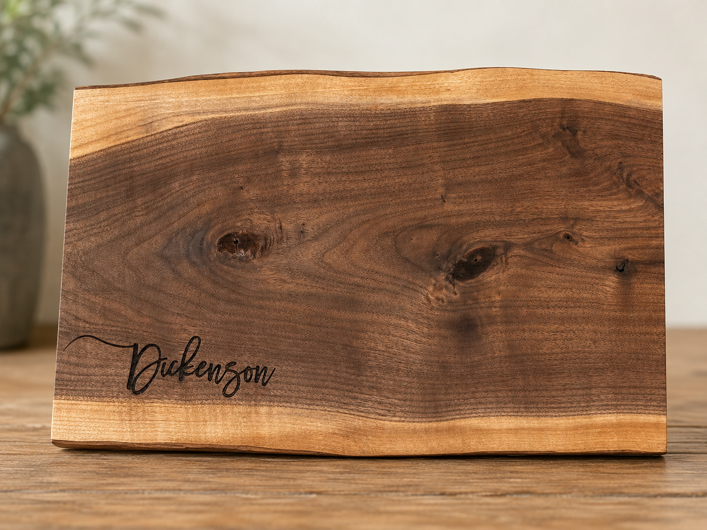 Live Edge walnut cutting board with custom engraved last name